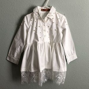 White blouse with pearl embellishments